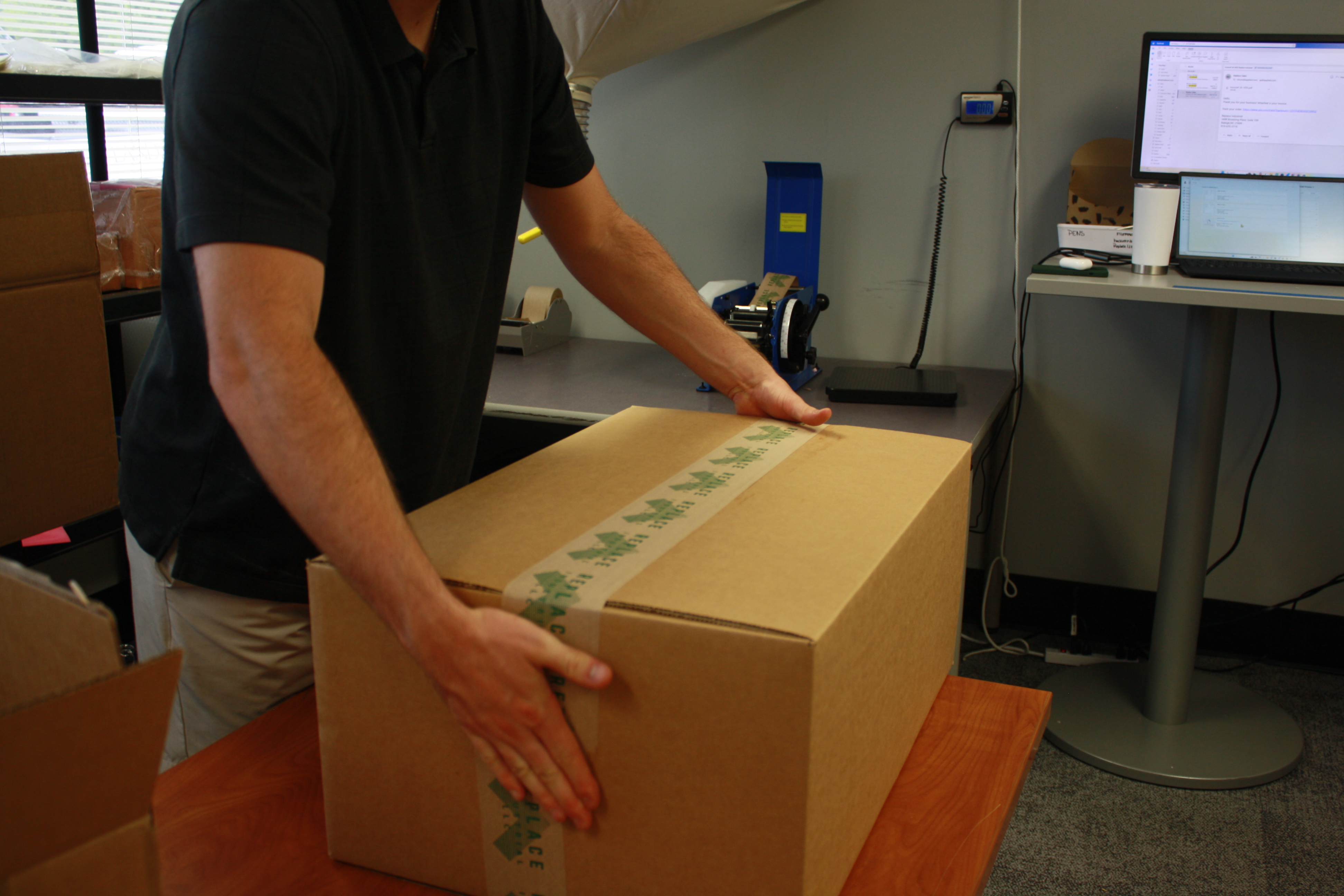 A Replace Industrial team member carefully moving a shipment