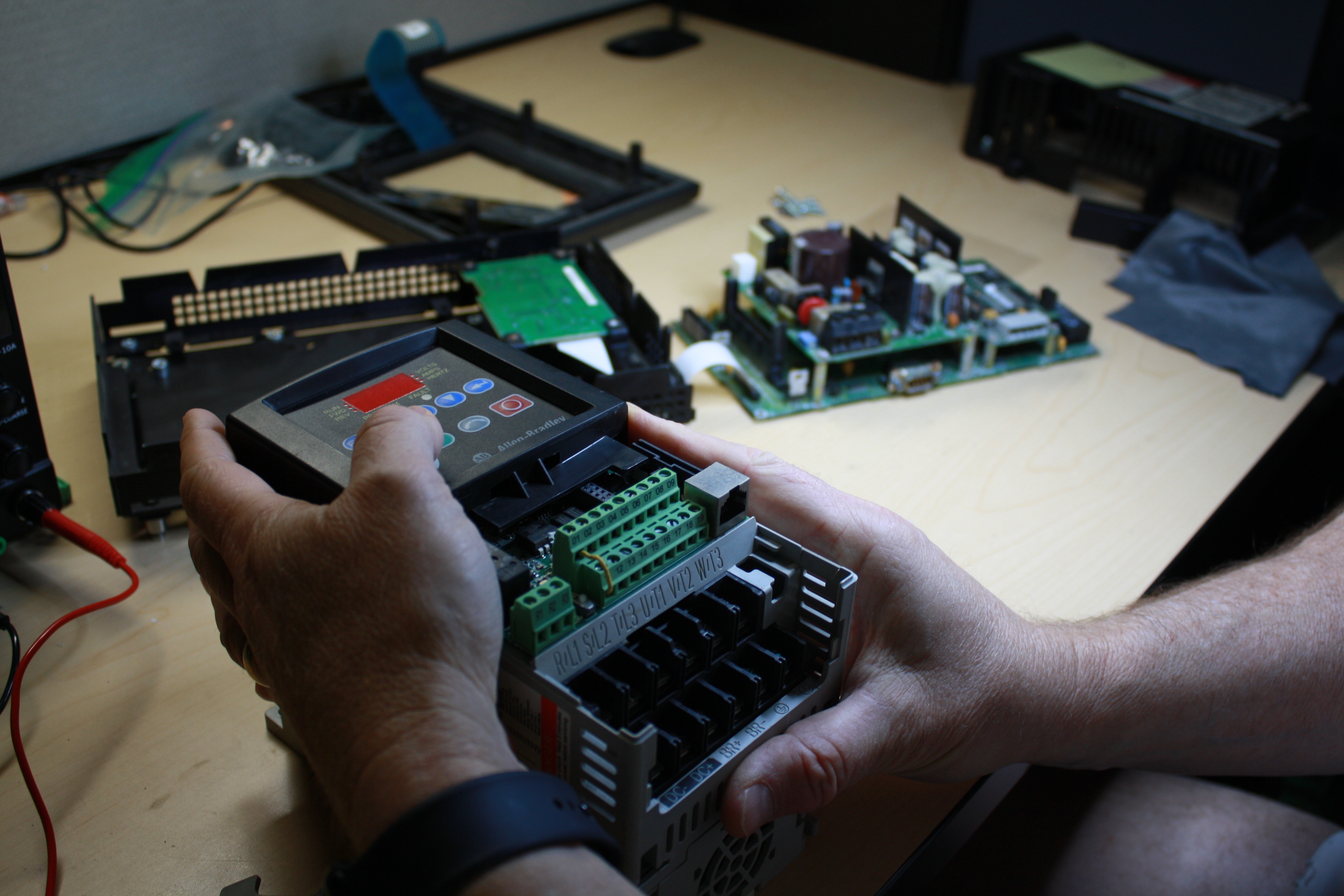 Replace Industrial technician repairing an industrial automation unit